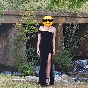 Womens black velvet fitted gown with slit to thigh, 1 sleeve, champagne lining